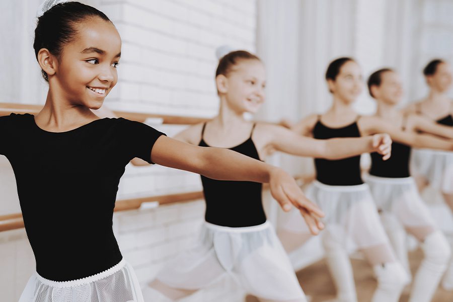 Dance Studio Insurance - Ballet Training of Group of Young Girls Indoors
