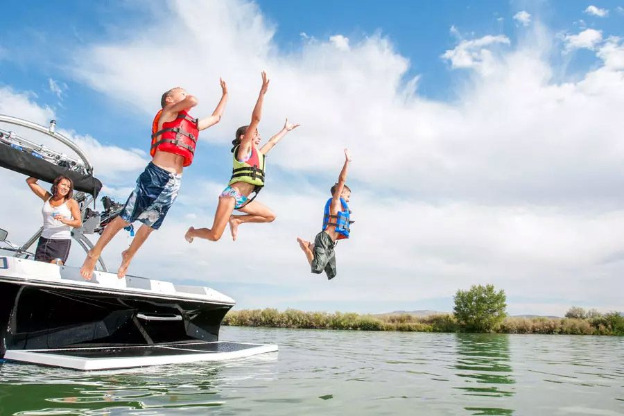 Watercraft-Insurance-Family-Jumping-Off-Boat-in-the-Lake